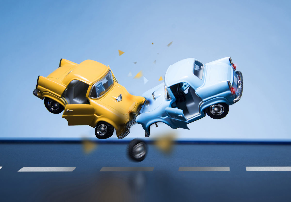 Classic fifties scale model toy cars accident on the road via iStock