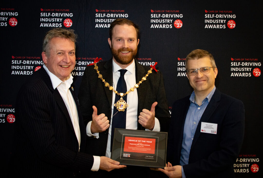 Town Mayor of Margate, Rob Yates, presents the inaugural Self-driving Industry Vehicle of the Year Award to Peter Stephens of Stagecoach and Matt Lawrence of Alexander Dennis