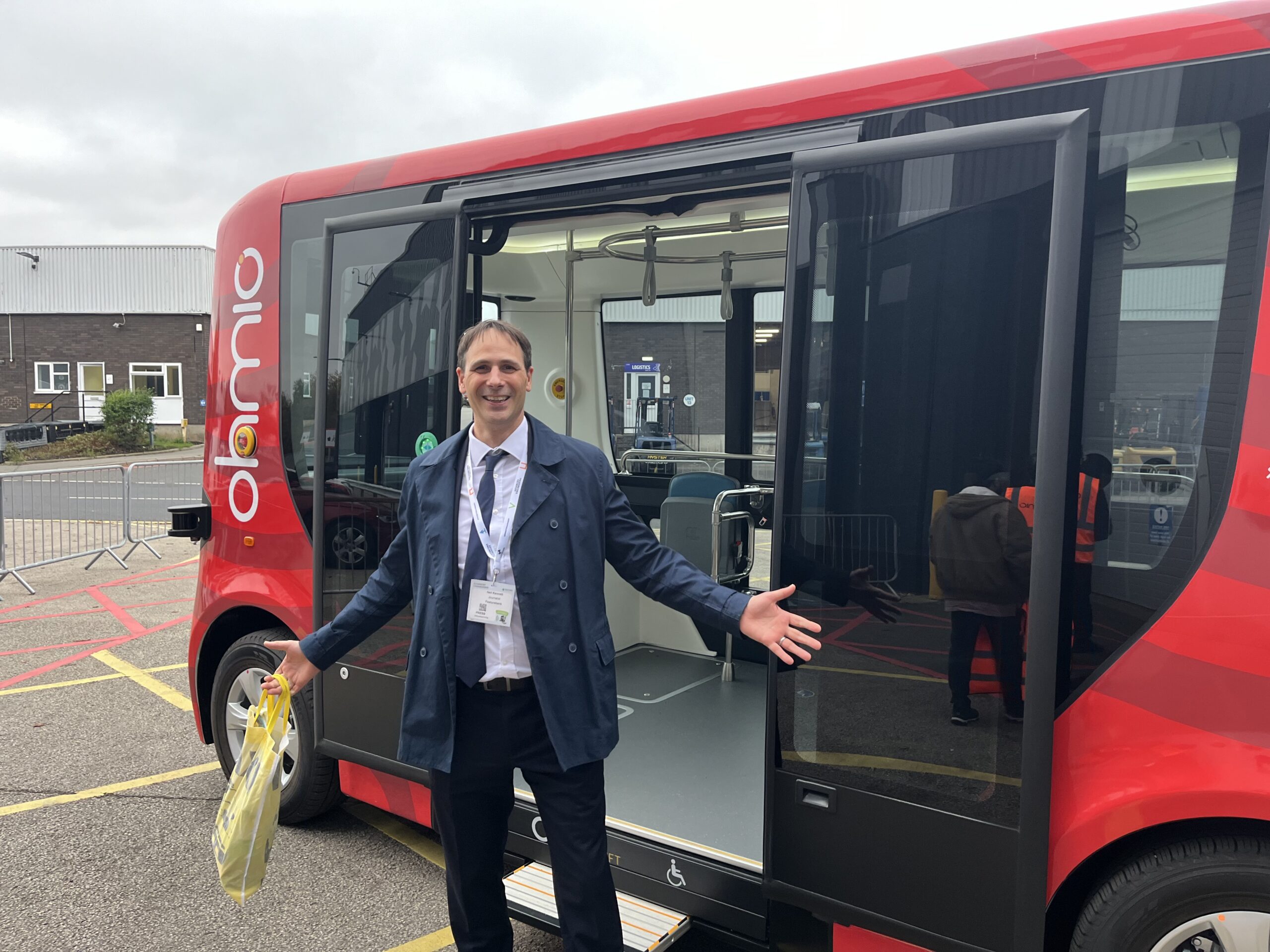 Neil Kennett with an Ohmio self-driving shuttle at the NEC, 2024