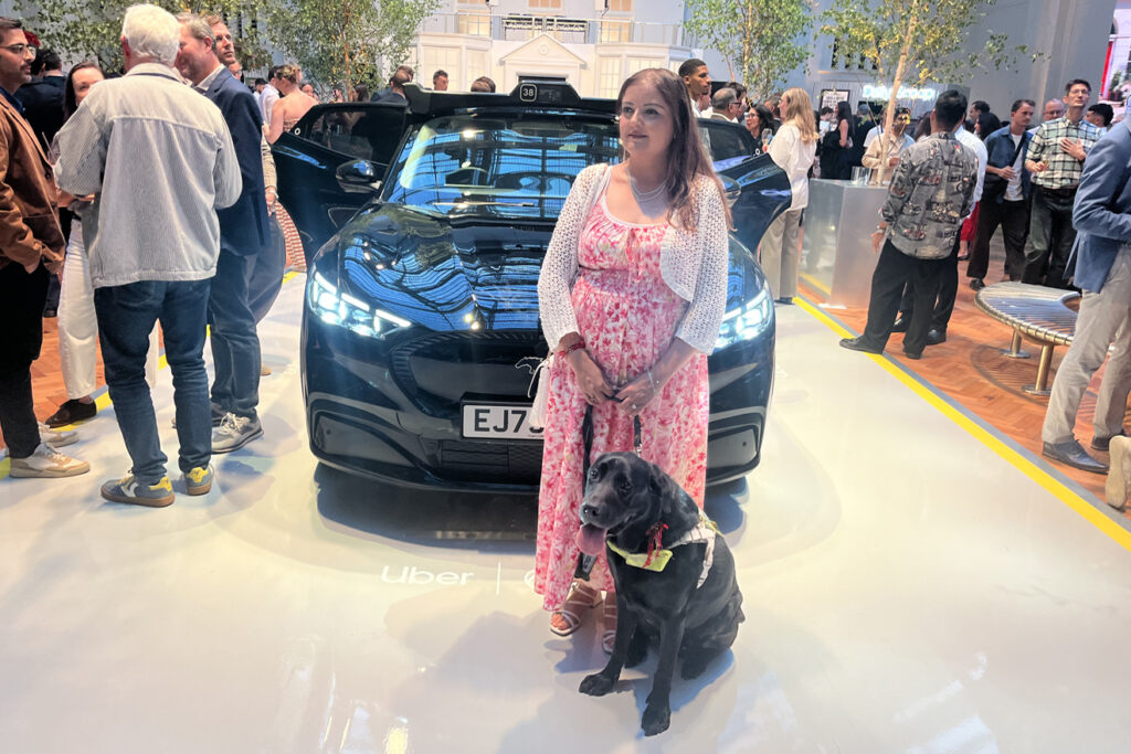 Bhavini Makwana with guide dog at Wayve Uber event in London, Sep 2026